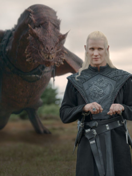 Matt Smith as Daemon Targaryen stands in front of a dragon in a still from HBO's House of the Dragon.
